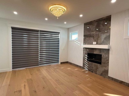 105 Hartford Road Nw, Calgary, AB - Indoor With Fireplace