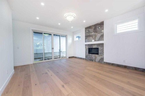 105 Hartford Road Nw, Calgary, AB - Indoor With Fireplace