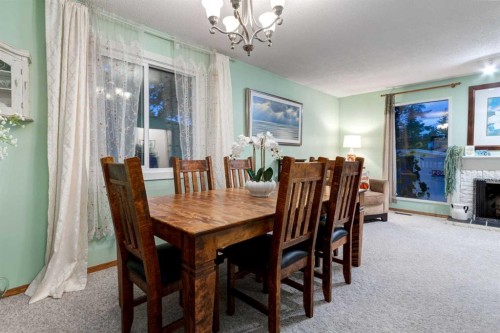 220 Oakridge Place Sw, Calgary, AB - Indoor Photo Showing Dining Room With Fireplace
