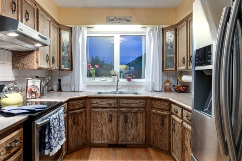 220 Oakridge Place Sw, Calgary, AB - Indoor Photo Showing Kitchen With Double Sink