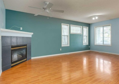 141 28 Avenue Ne, Calgary, AB - Indoor Photo Showing Other Room With Fireplace