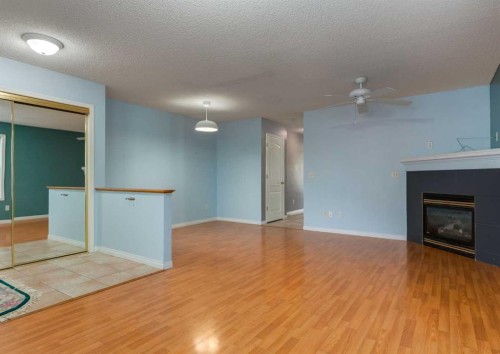141 28 Avenue Ne, Calgary, AB - Indoor Photo Showing Other Room With Fireplace
