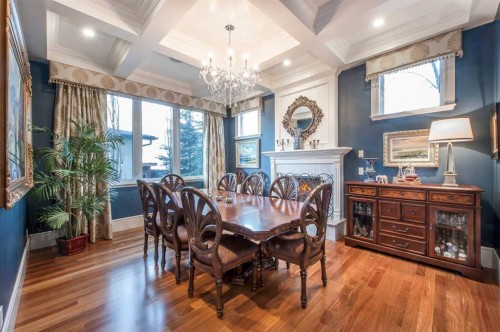 814 Radford Road Ne, Calgary, AB - Indoor Photo Showing Dining Room With Fireplace