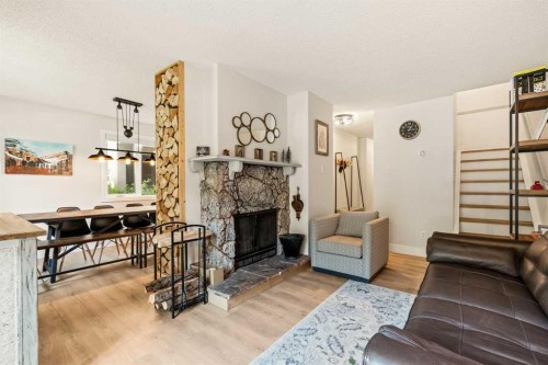 109-200 Three Sisters Drive, Canmore, AB - Indoor Photo Showing Living Room With Fireplace
