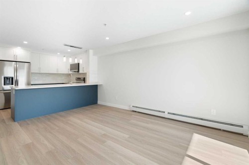 1204-4975 130 Avenue Se, Calgary, AB - Indoor Photo Showing Kitchen With Stainless Steel Kitchen