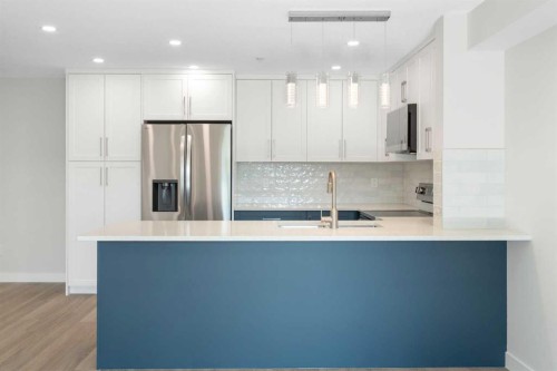 1204-4975 130 Avenue Se, Calgary, AB - Indoor Photo Showing Kitchen With Stainless Steel Kitchen With Upgraded Kitchen