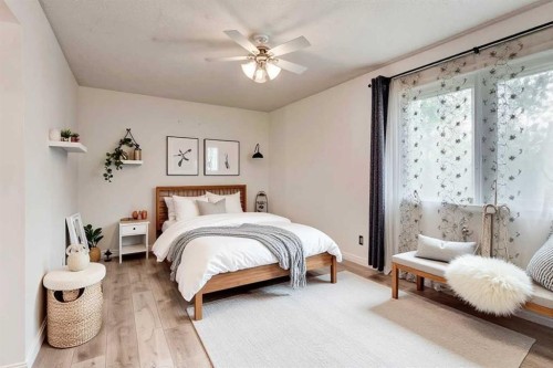 17 Millrise Lane Sw, Calgary, AB - Indoor Photo Showing Bedroom