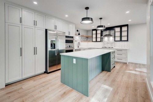 17 Millrise Lane Sw, Calgary, AB - Indoor Photo Showing Kitchen With Upgraded Kitchen