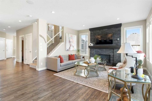 33 Silverado Crest Bay Sw, Calgary, AB - Indoor Photo Showing Living Room With Fireplace