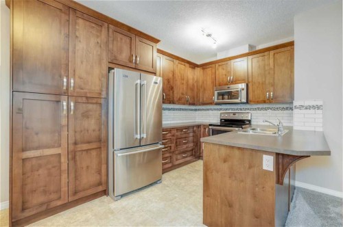 1206-522 Cranford Drive Se, Calgary, AB - Indoor Photo Showing Kitchen With Double Sink