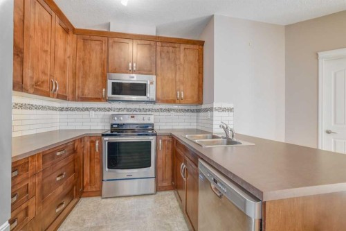 1206-522 Cranford Drive Se, Calgary, AB - Indoor Photo Showing Kitchen With Double Sink With Upgraded Kitchen