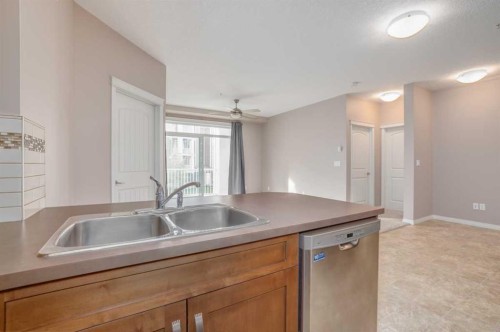 1206-522 Cranford Drive Se, Calgary, AB - Indoor Photo Showing Kitchen With Double Sink
