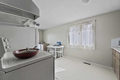 11203 6 Street Sw, Calgary, AB - Indoor Photo Showing Laundry Room