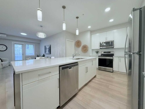 310-20 Mahogany Mews Se, Calgary, AB - Indoor Photo Showing Kitchen With Stainless Steel Kitchen With Upgraded Kitchen