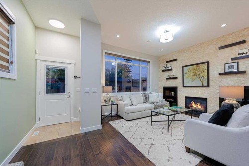 462 23 Avenue Nw, Calgary, AB - Indoor Photo Showing Living Room With Fireplace