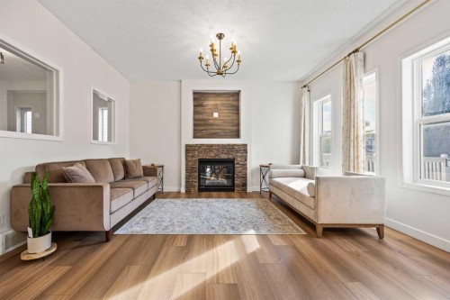 366 Bridleridge View Sw, Calgary, AB - Indoor Photo Showing Living Room With Fireplace
