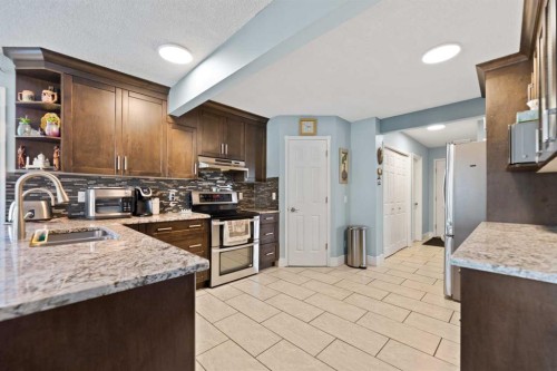 86 Coral Springs Close Ne, Calgary, AB - Indoor Photo Showing Kitchen With Double Sink