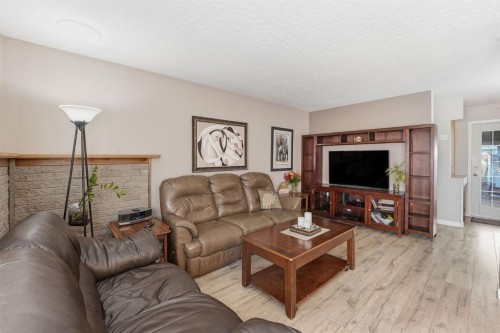 74 Mcrae Street East, Okotoks, AB - Indoor Photo Showing Living Room