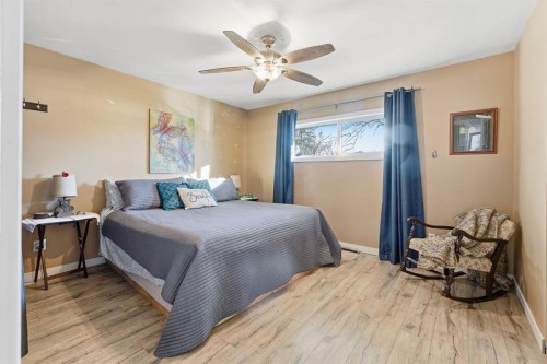 74 Mcrae Street East, Okotoks, AB - Indoor Photo Showing Bedroom