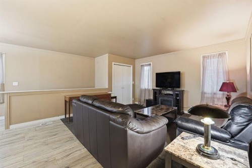 74 Mcrae Street East, Okotoks, AB - Indoor Photo Showing Living Room