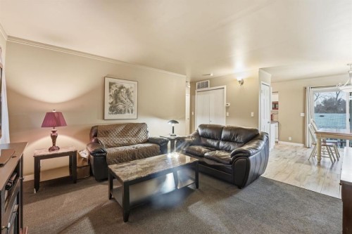 74 Mcrae Street East, Okotoks, AB - Indoor Photo Showing Living Room
