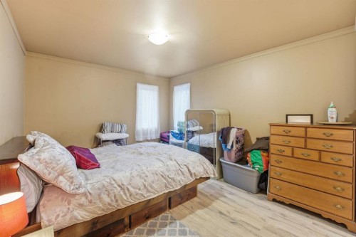 74 Mcrae Street East, Okotoks, AB - Indoor Photo Showing Bedroom