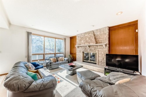 17 Santana Manor Nw, Calgary, AB - Indoor Photo Showing Living Room With Fireplace