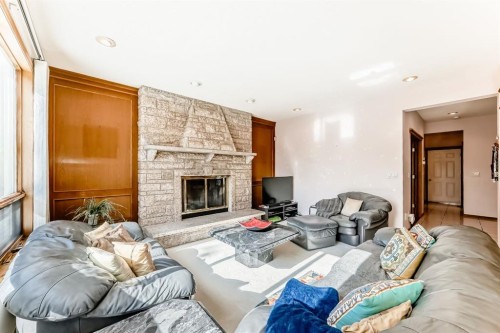17 Santana Manor Nw, Calgary, AB - Indoor Photo Showing Living Room With Fireplace