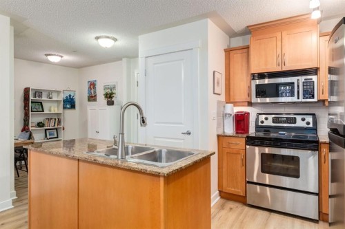 216-2233 34 Avenue Sw, Calgary, AB - Indoor Photo Showing Kitchen With Stainless Steel Kitchen With Double Sink