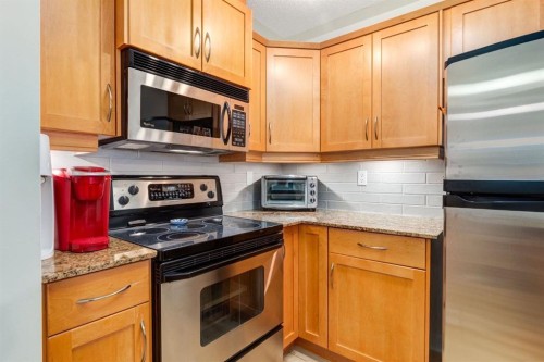 216-2233 34 Avenue Sw, Calgary, AB - Indoor Photo Showing Kitchen With Stainless Steel Kitchen