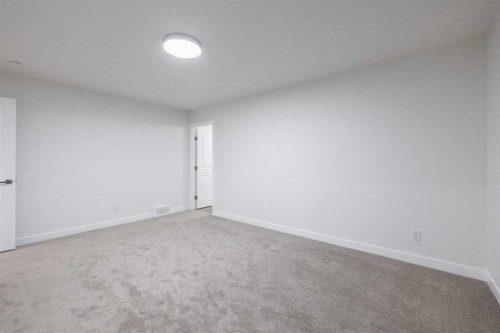 145 Sunstone Way, Balzac, AB - Indoor Photo Showing Other Room