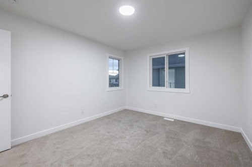 145 Sunstone Way, Balzac, AB - Indoor Photo Showing Other Room