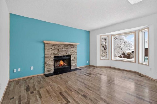 314 Nelson Road, Carseland, AB - Indoor Photo Showing Living Room With Fireplace