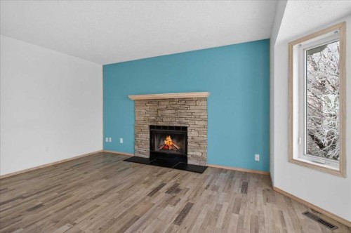 314 Nelson Road, Carseland, AB - Indoor Photo Showing Living Room With Fireplace