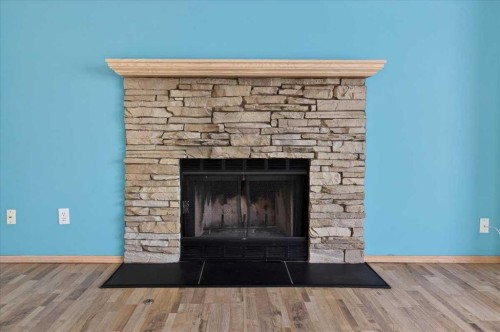 314 Nelson Road, Carseland, AB - Indoor Photo Showing Living Room With Fireplace