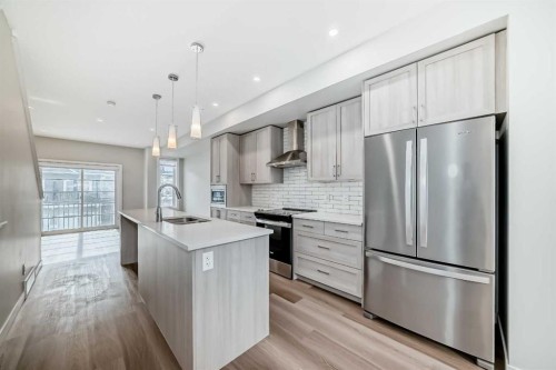 710 Sage Hill Grove Nw, Calgary, AB - Indoor Photo Showing Kitchen With Stainless Steel Kitchen With Upgraded Kitchen