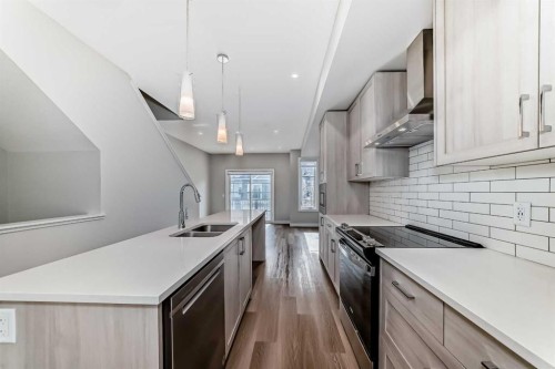 710 Sage Hill Grove Nw, Calgary, AB - Indoor Photo Showing Kitchen With Double Sink With Upgraded Kitchen