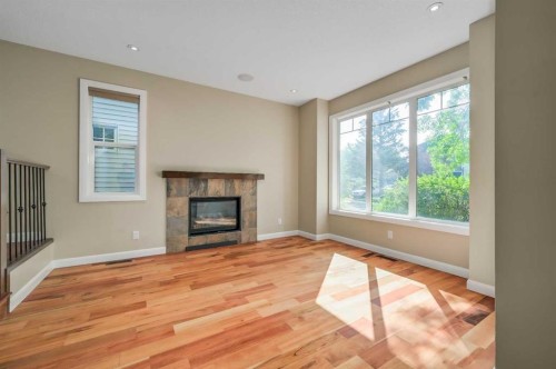 7418 36 Avenue Nw, Calgary, AB - Indoor Photo Showing Living Room With Fireplace