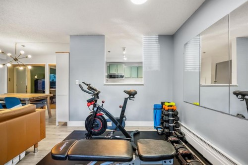 7-821 3 Avenue Sw, Calgary, AB - Indoor Photo Showing Gym Room