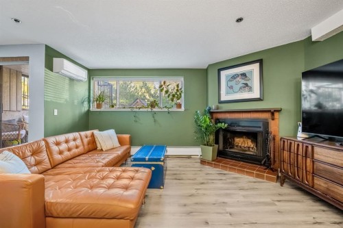 7-821 3 Avenue Sw, Calgary, AB - Indoor Photo Showing Living Room With Fireplace
