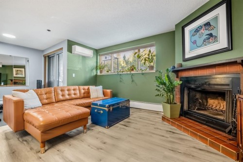 7-821 3 Avenue Sw, Calgary, AB - Indoor Photo Showing Living Room With Fireplace