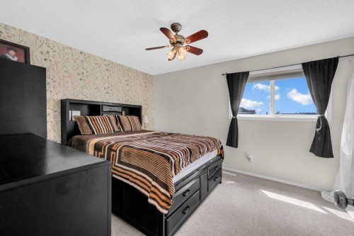 4 Saddlecreek Terrace Ne, Calgary, AB - Indoor Photo Showing Bedroom