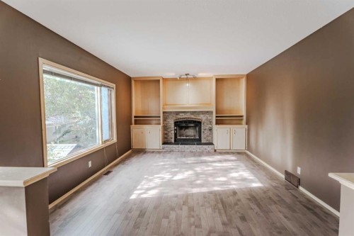 135 Canterbury Court Sw, Calgary, AB - Indoor Photo Showing Living Room With Fireplace