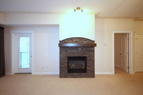 518-30 Discovery Ridge Close Sw, Calgary, AB - Indoor Photo Showing Living Room With Fireplace