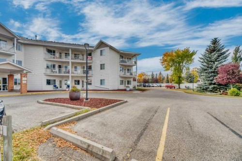 102-3 Parklane Way, Strathmore, AB - Outdoor With Facade