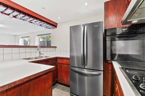 436 Attica Drive Se, Calgary, AB - Indoor Photo Showing Kitchen With Double Sink