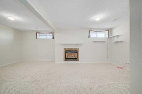 54-5790 Patina Drive Sw, Calgary, AB - Indoor With Fireplace