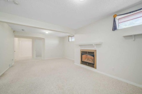 54-5790 Patina Drive Sw, Calgary, AB - Indoor With Fireplace