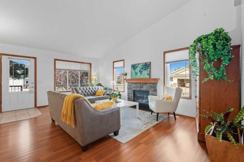79 Hillcrest Boulevard, Strathmore, AB - Indoor Photo Showing Living Room With Fireplace