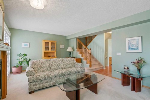 79 Scenic Gardens Nw, Calgary, AB - Indoor Photo Showing Living Room With Fireplace